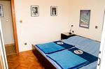 Apartment big sleeping room towards entry door