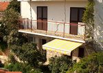 Apartment balcony and studio beneath