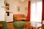 Apartment, living room, view from sitting corner to the balcony-door and additional couch for2
